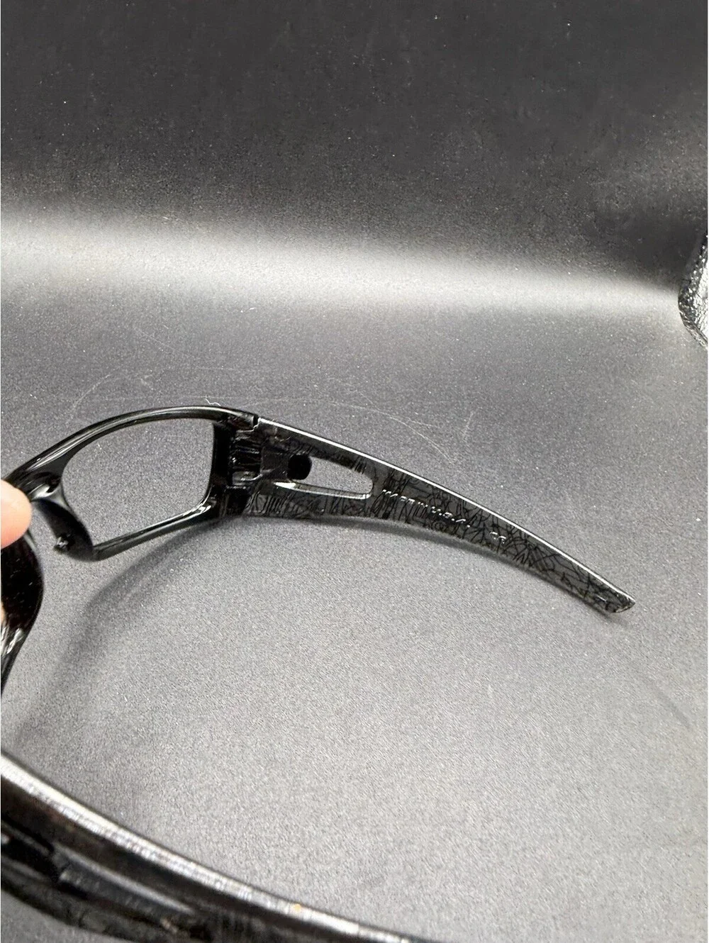 Oakley Crankcase Polished Black/Dark Grey History Text Frame (No Icons)
